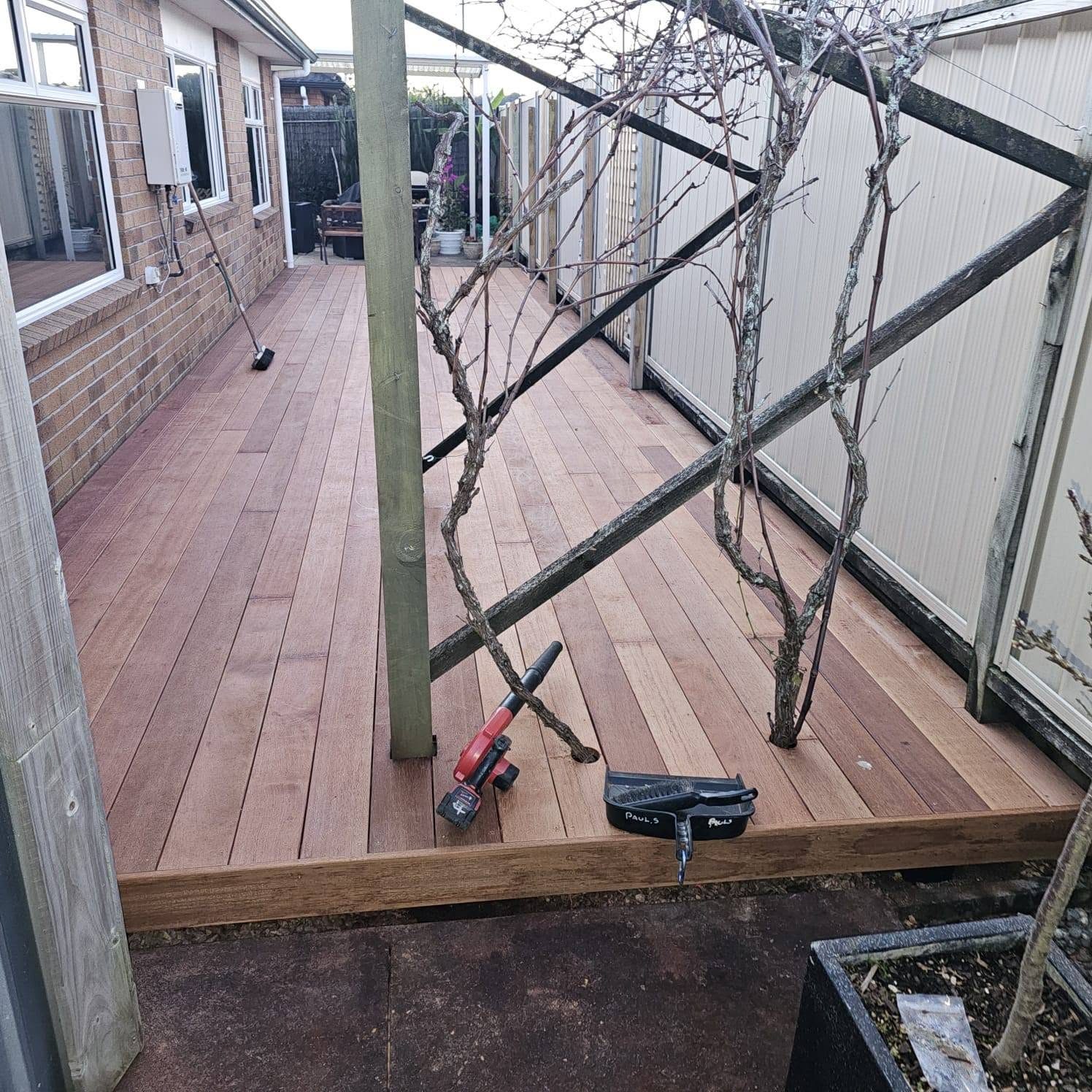 Hardwood boards being laid across the courtyard subframe