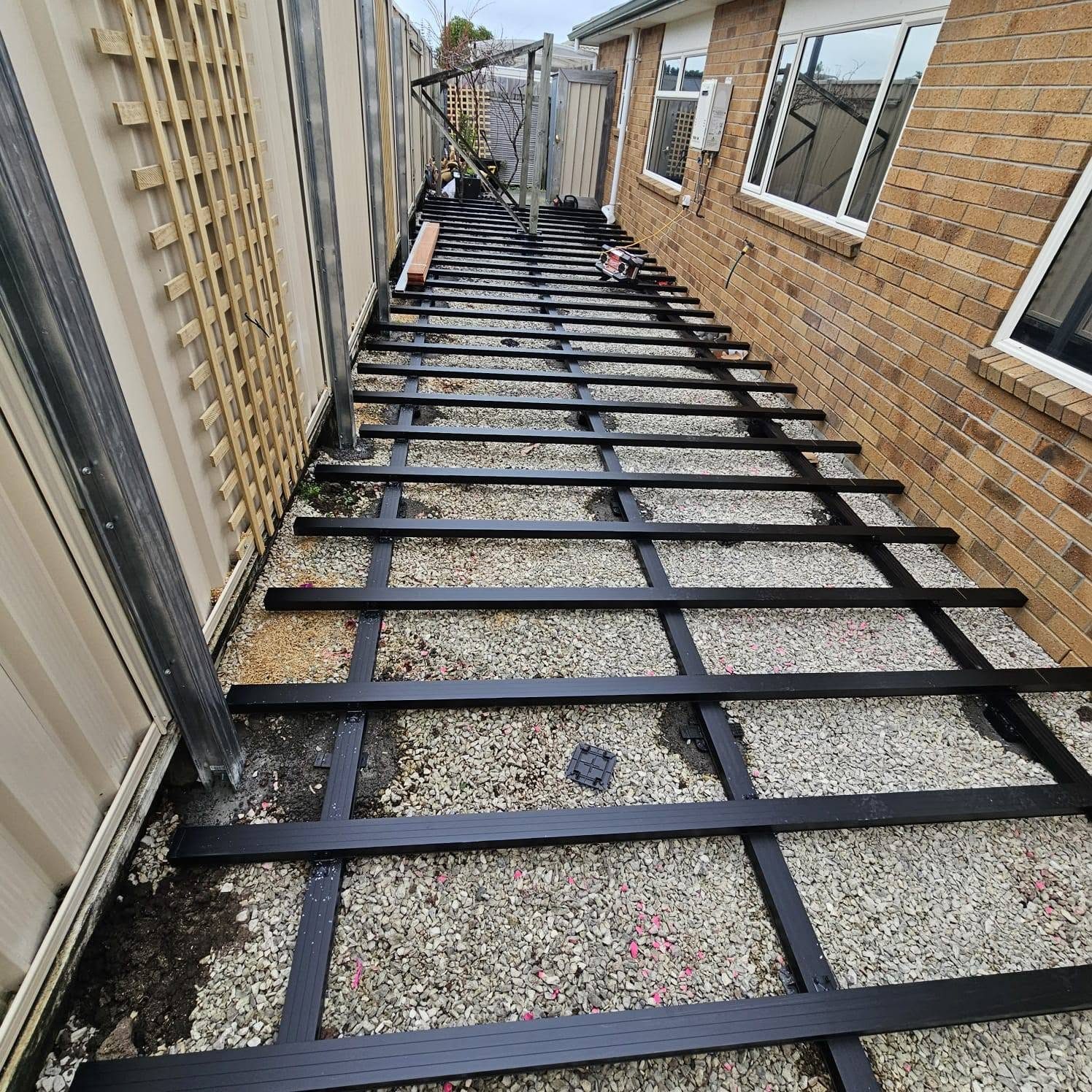 Adjustable aluminium subframe set out down the length of the courtyard