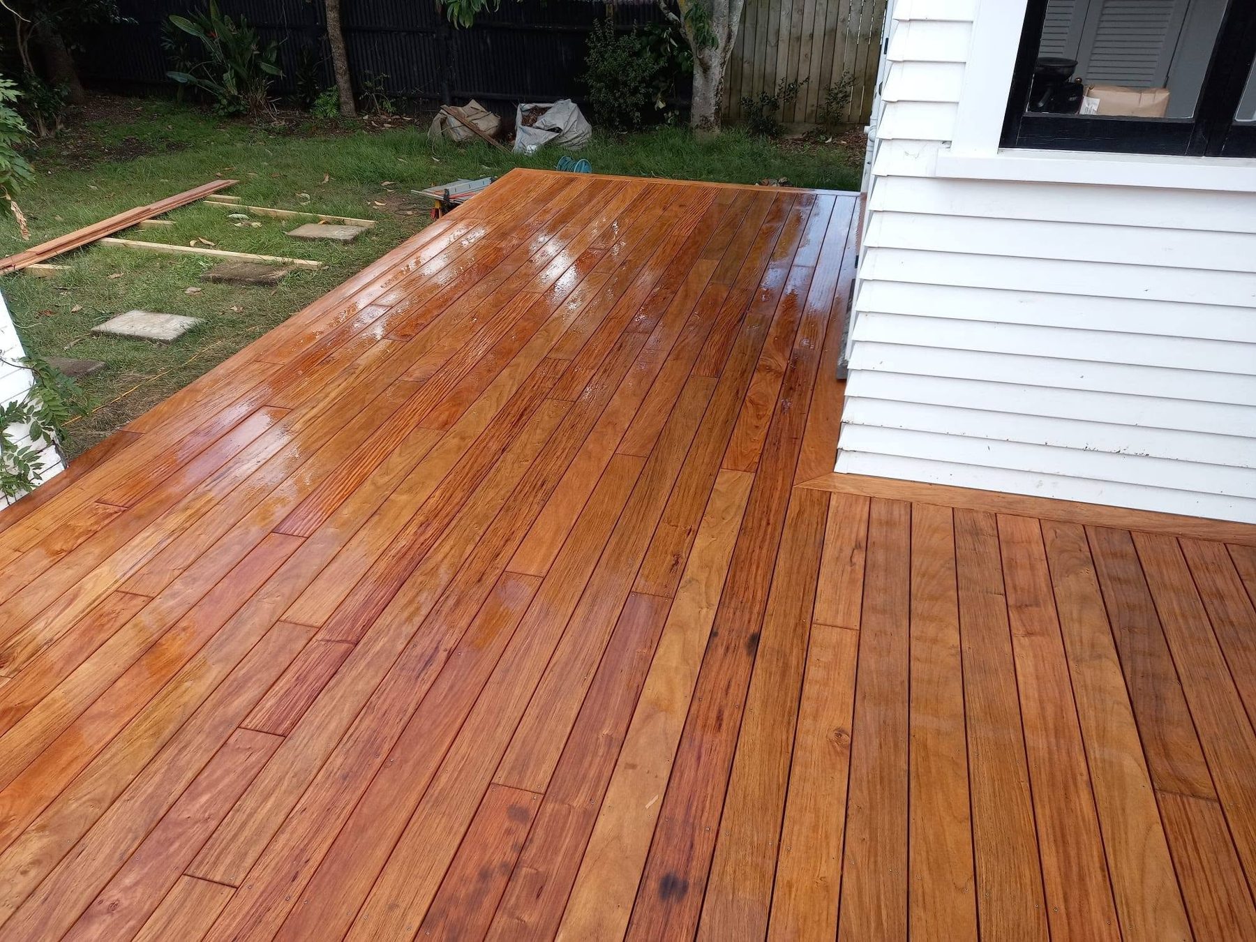 Freshly oiled kwila decking after rain