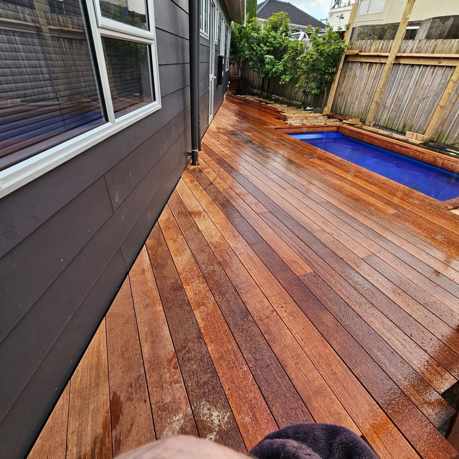 Kwila decking finished flush against the house and pool edge
