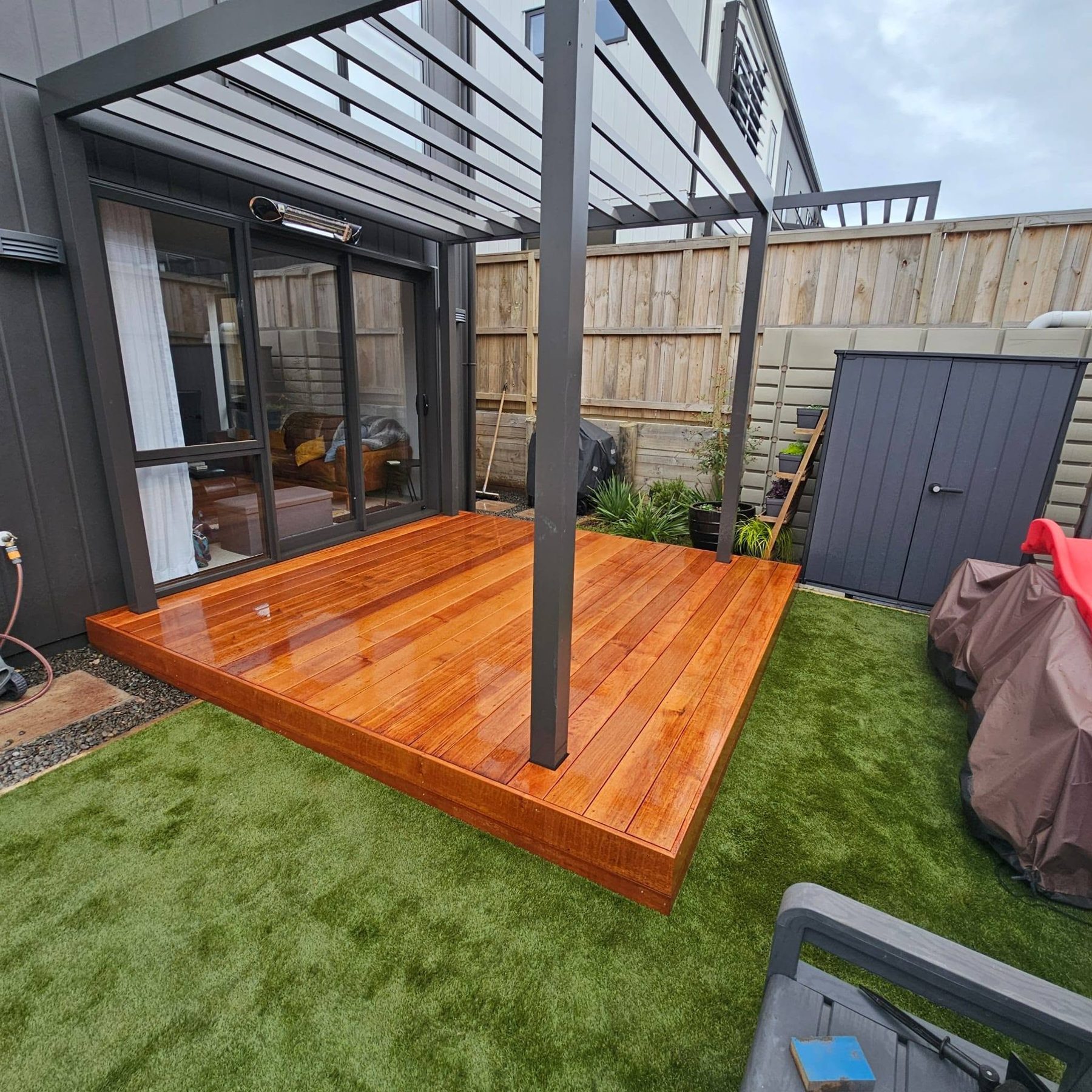Completed kwila deck framed around the louvre roof posts