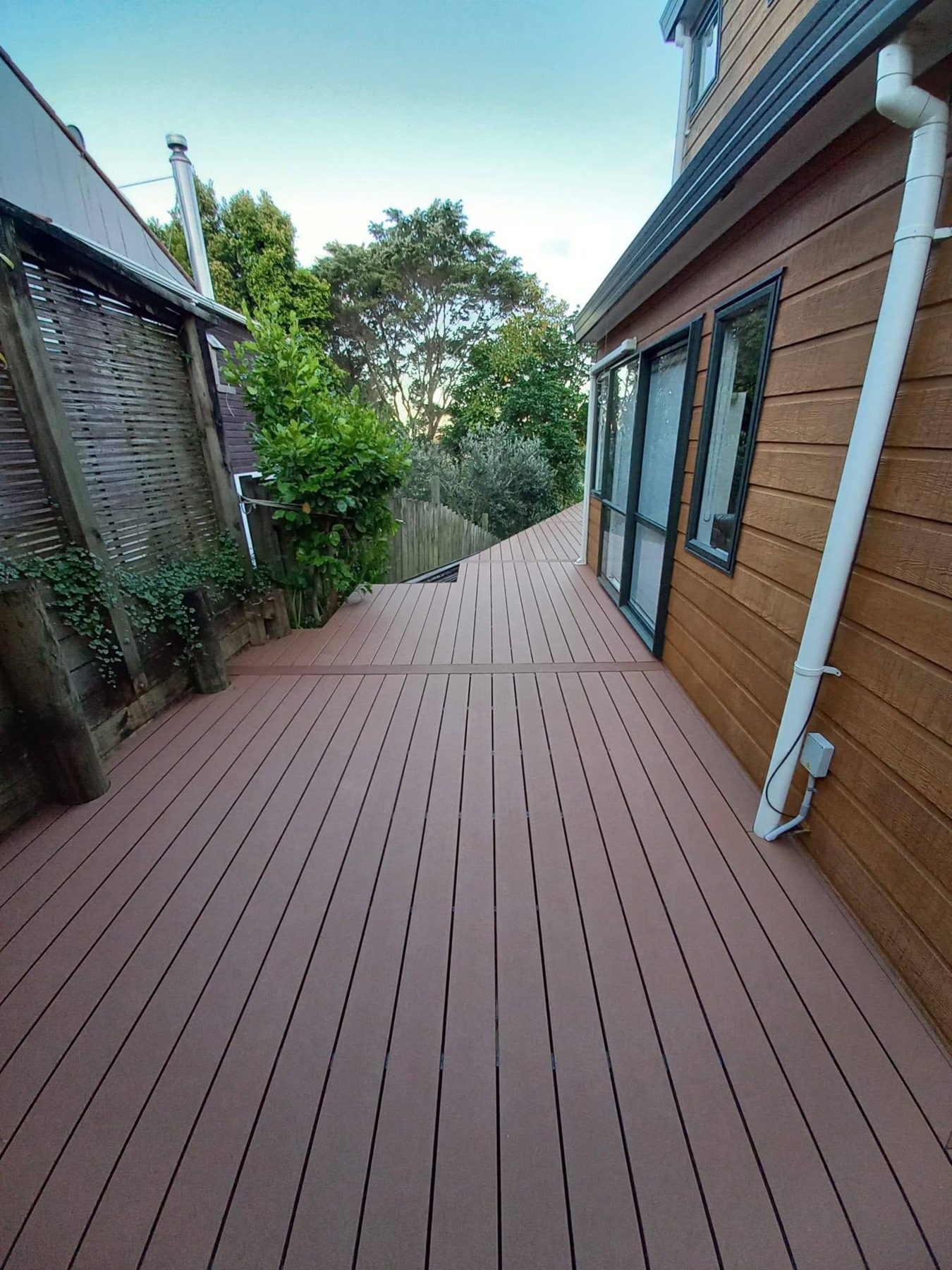 Composite boards run lengthways down a narrow side space