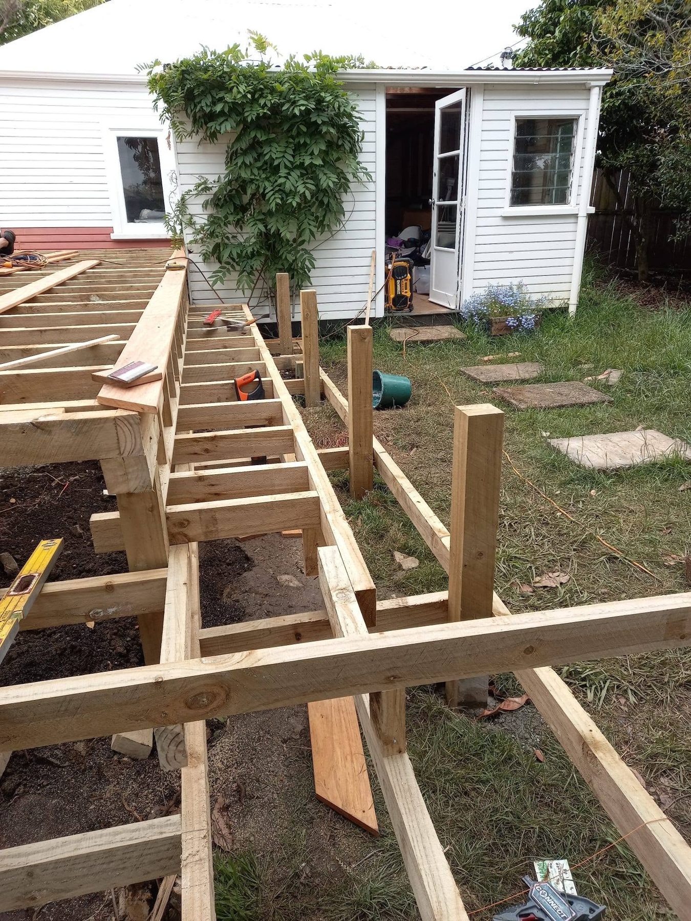 Treated timber posts and bearers set out on the lawn