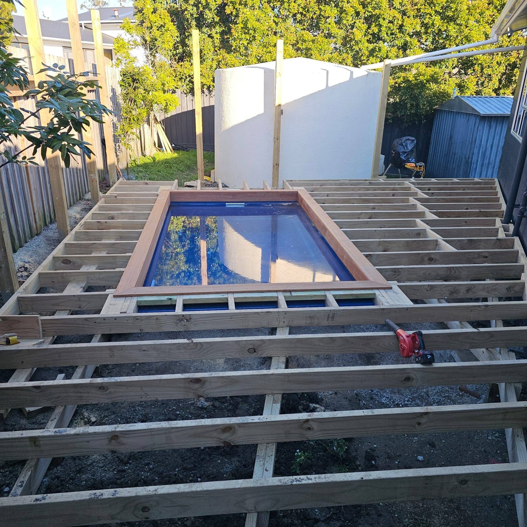 Framing extended out from the house towards the pool