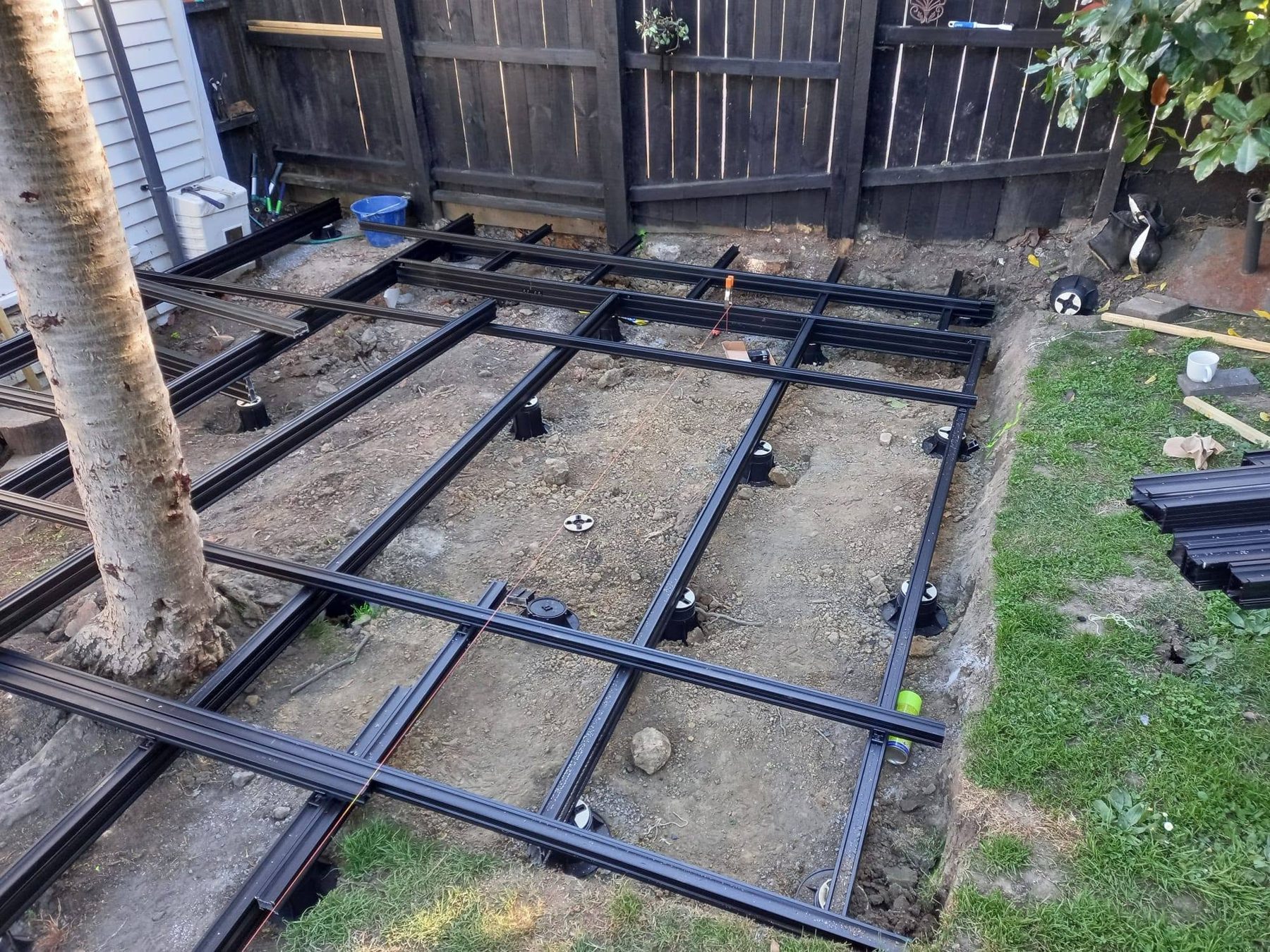 Adjustable aluminium subframe set out ready for tiles