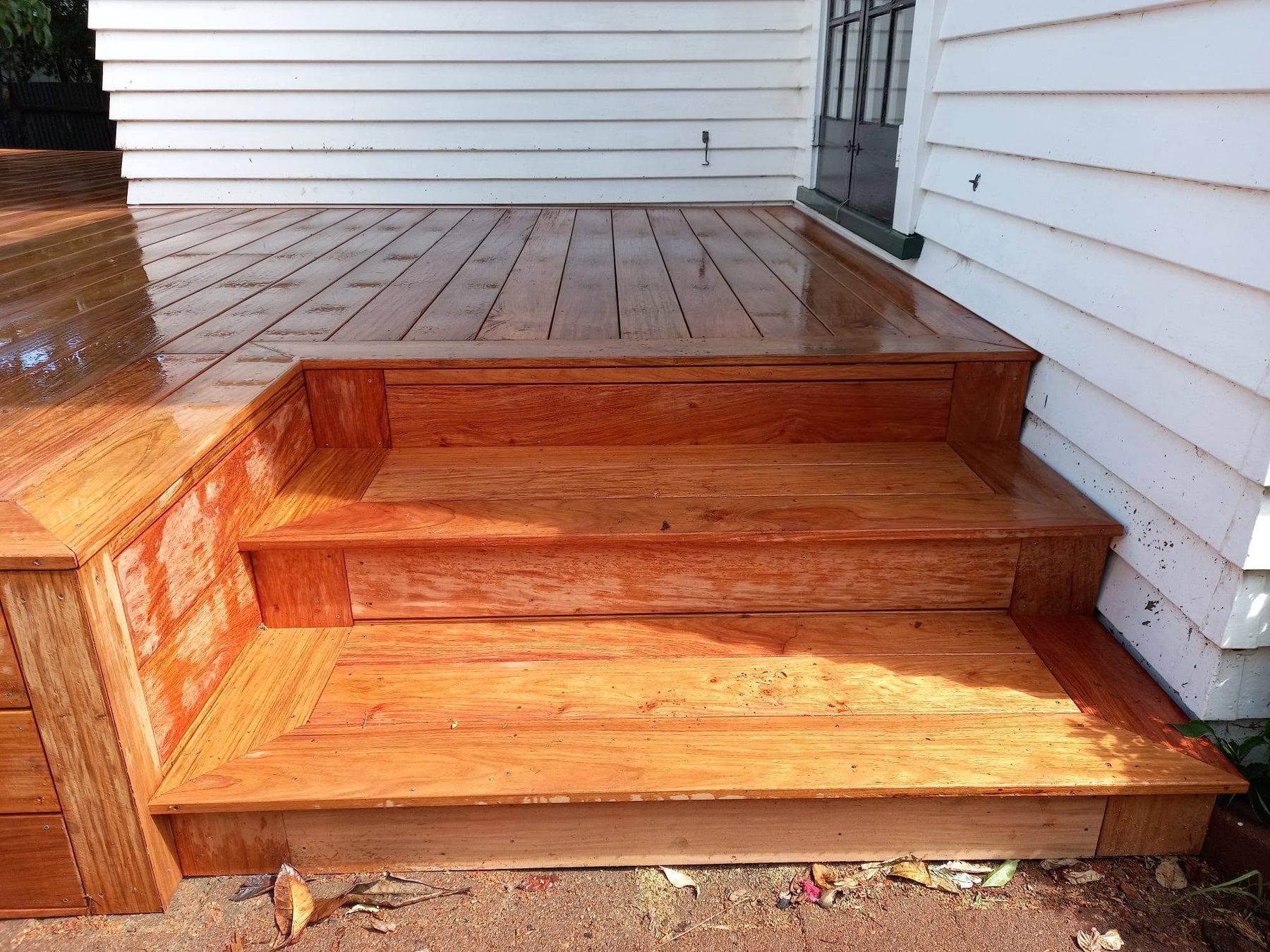 Built-in kwila bench seat along the edge of the deck