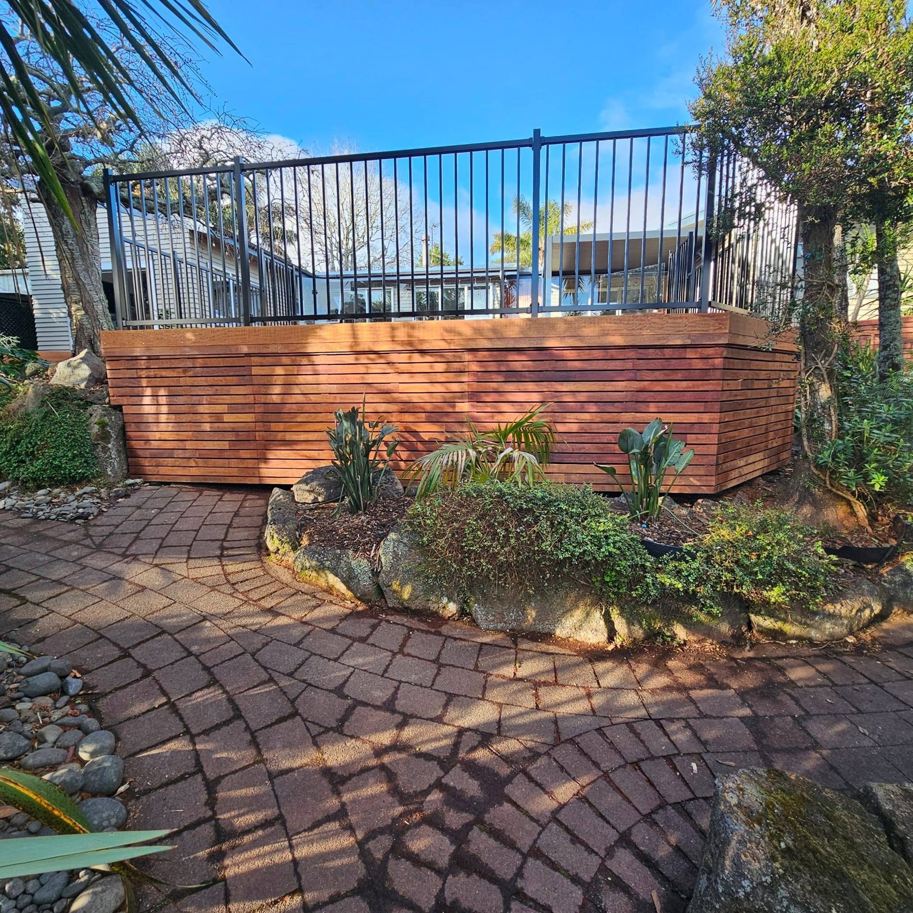 Timber retaining and paving detail beside the deck