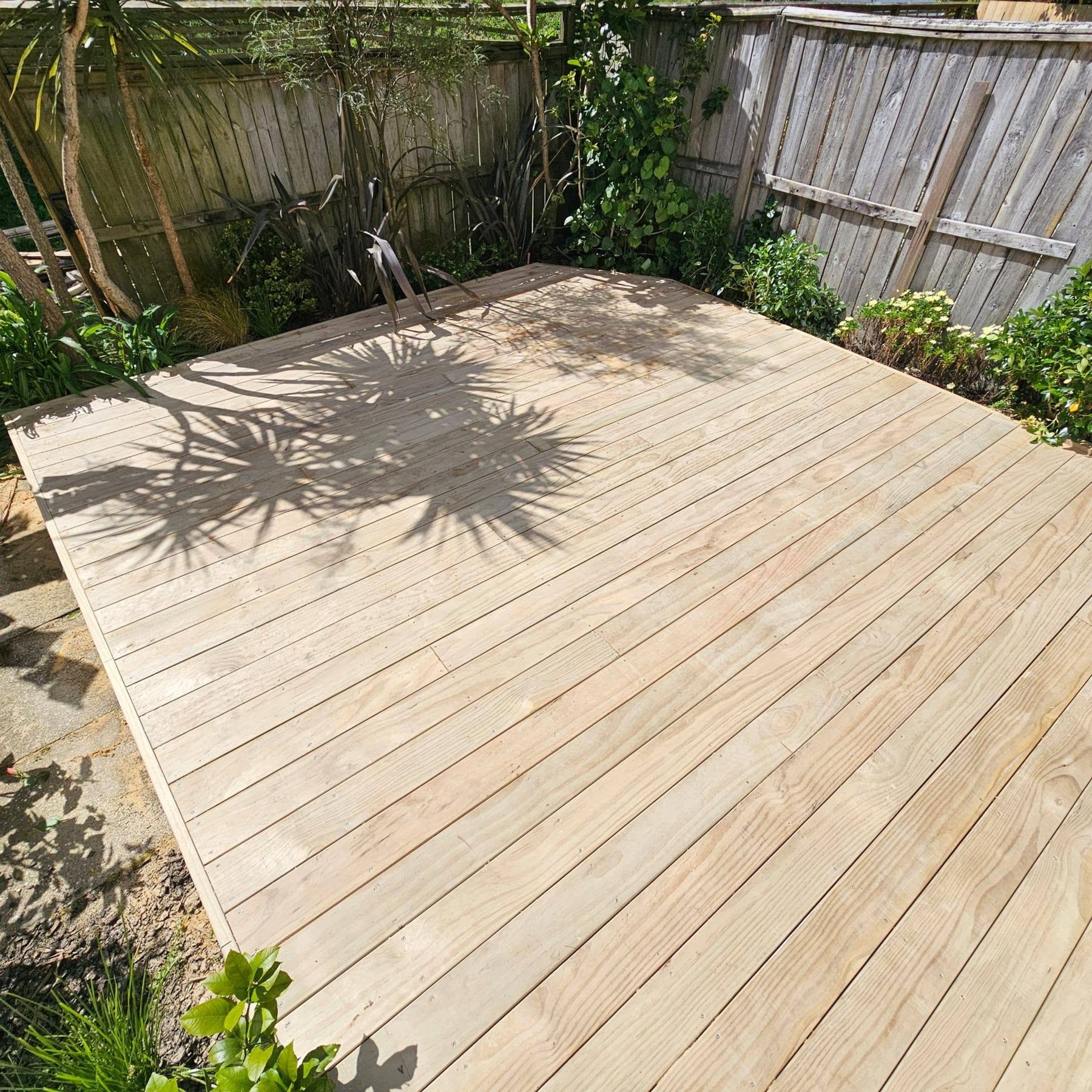 Finished timber deck squared up across the back yard