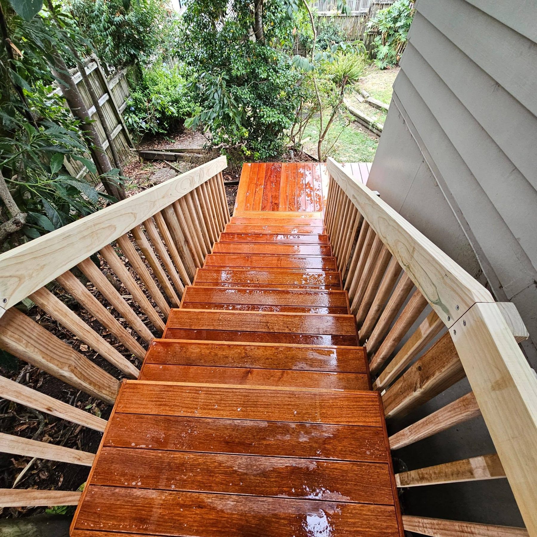 Freshly oiled hardwood treads looking down the stair run