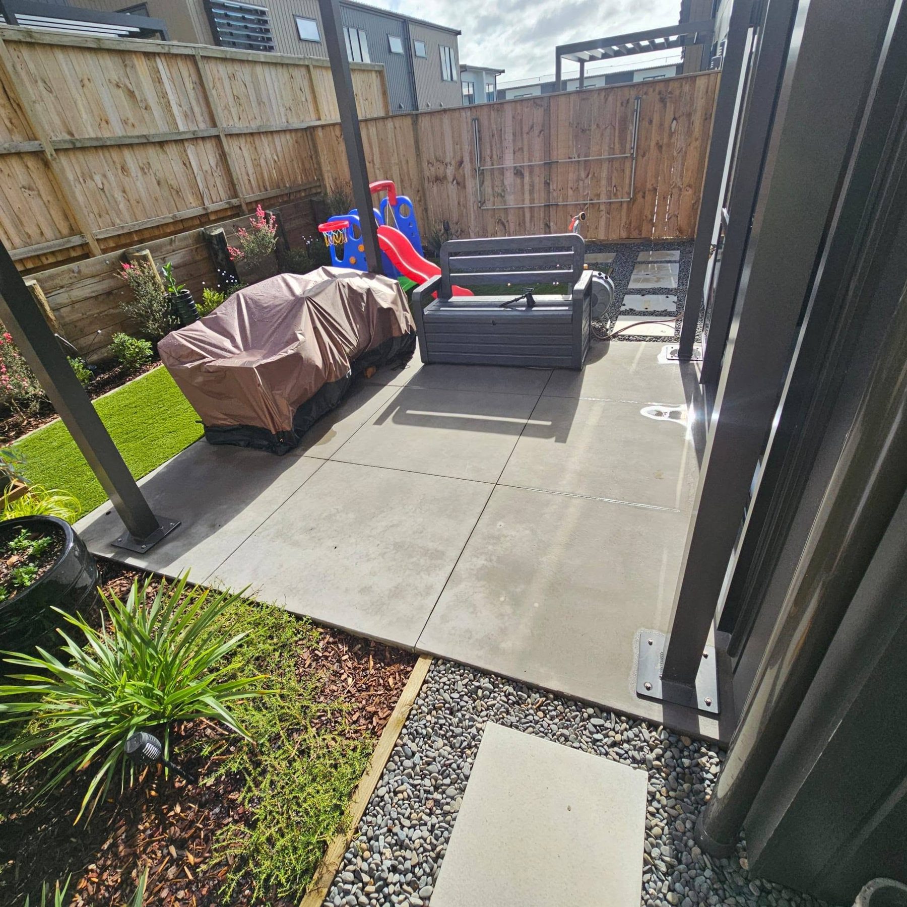 Concrete patio and louvre roof posts before the deck was built