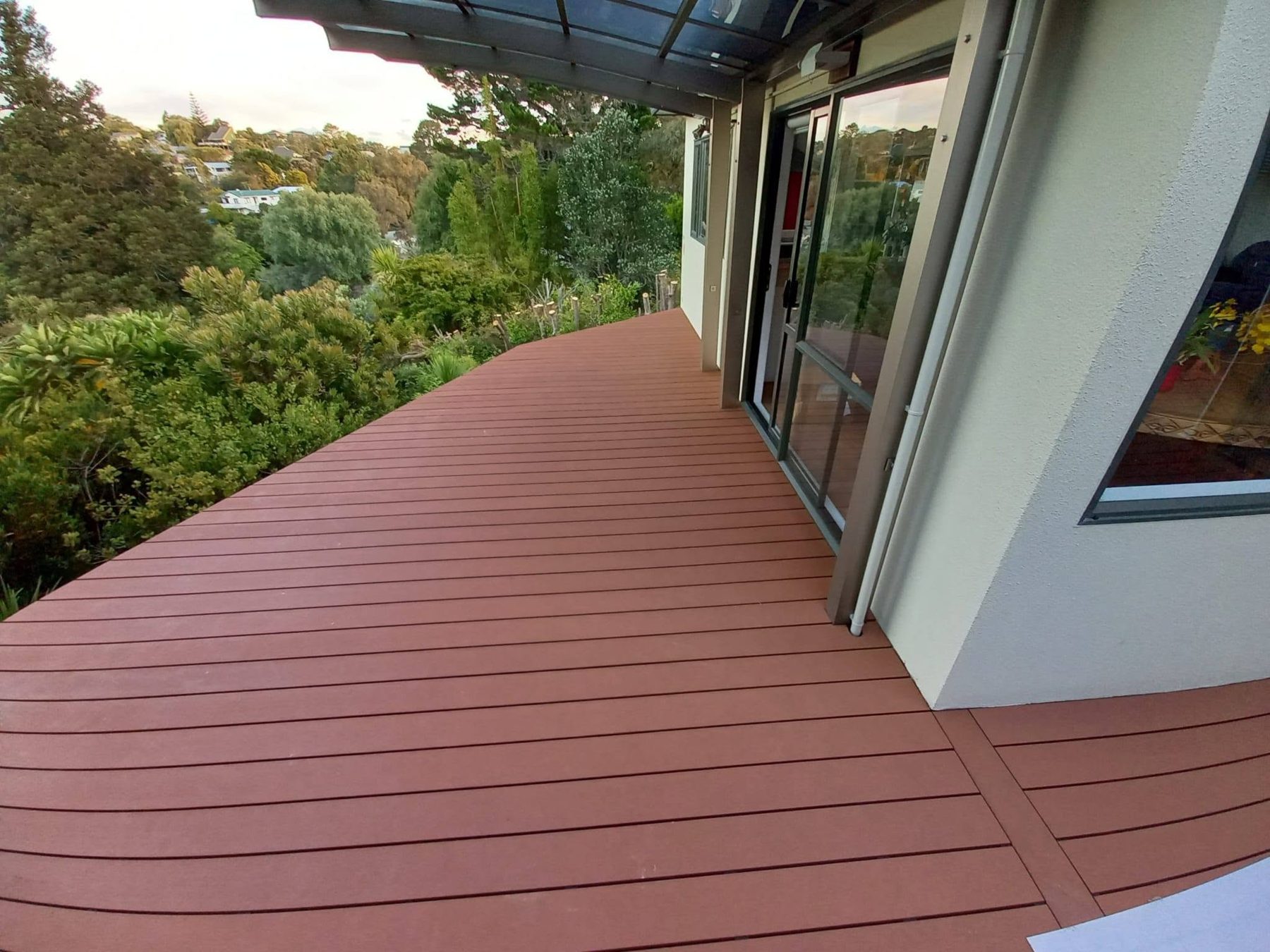 Wide composite walkway beside the house