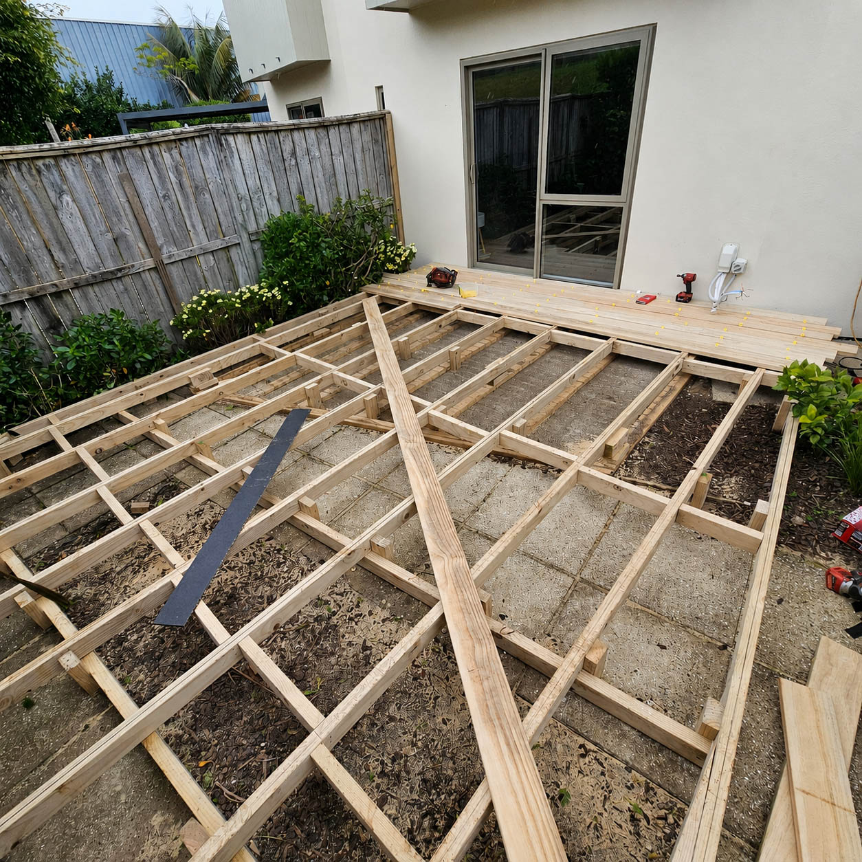 New treated timber joists framed across the yard